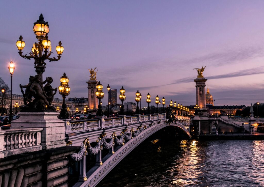 Bridge illuminated at twilight in Paris
